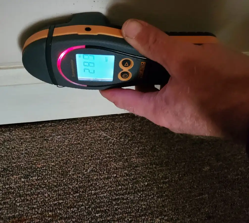 Moisture detection at baseboard during Storm Damage Restoration in Kittery